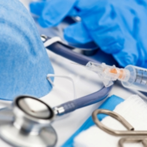 Researchers reviewing clinical data and imaging on a digital display